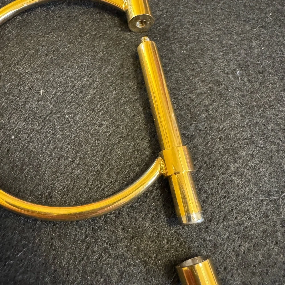 Gold tone D shaped cuff bracelet with screw closure